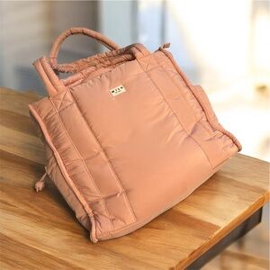 Wilo The Label Puffer Rounded Weekender Bag in clay pink with an accessory bag